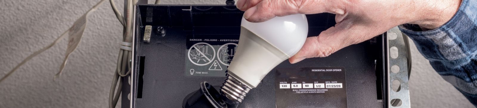Comparison of LED and traditional filament light bulbs, highlighting energy efficiency and brightness for garage door openers in Casselberry.