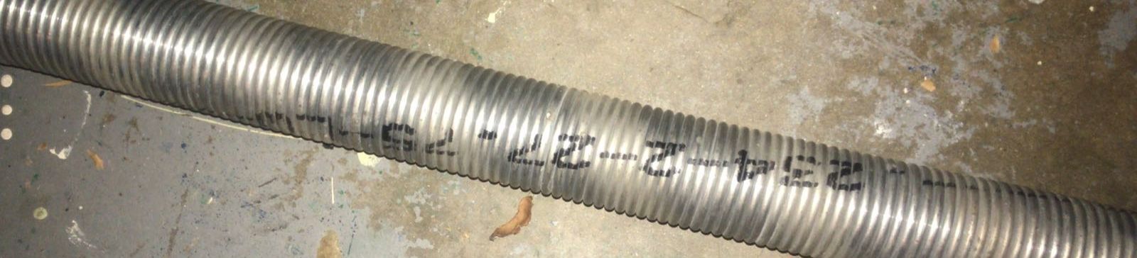 Close-up of a garage door spring in a Casselberry home, ready for replacement due to wear.